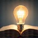 Open book with a lightbulb